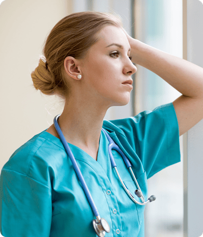 hospital employee gazing out window